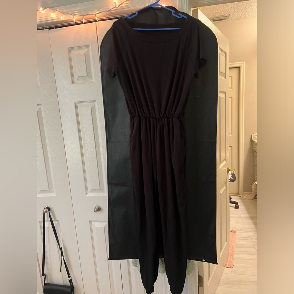 I don’t know the brand but it’s an XL off the shoulder black romper